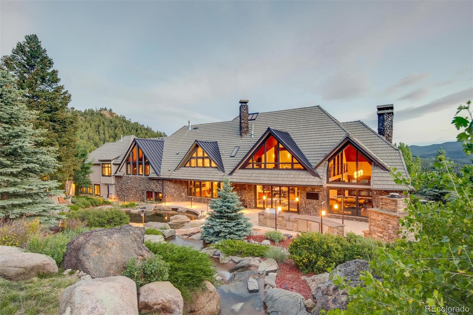 6917 Timbers Drive Evergreen, CO 80439 - Photo 3 of 39 an aerial view of multiple houses