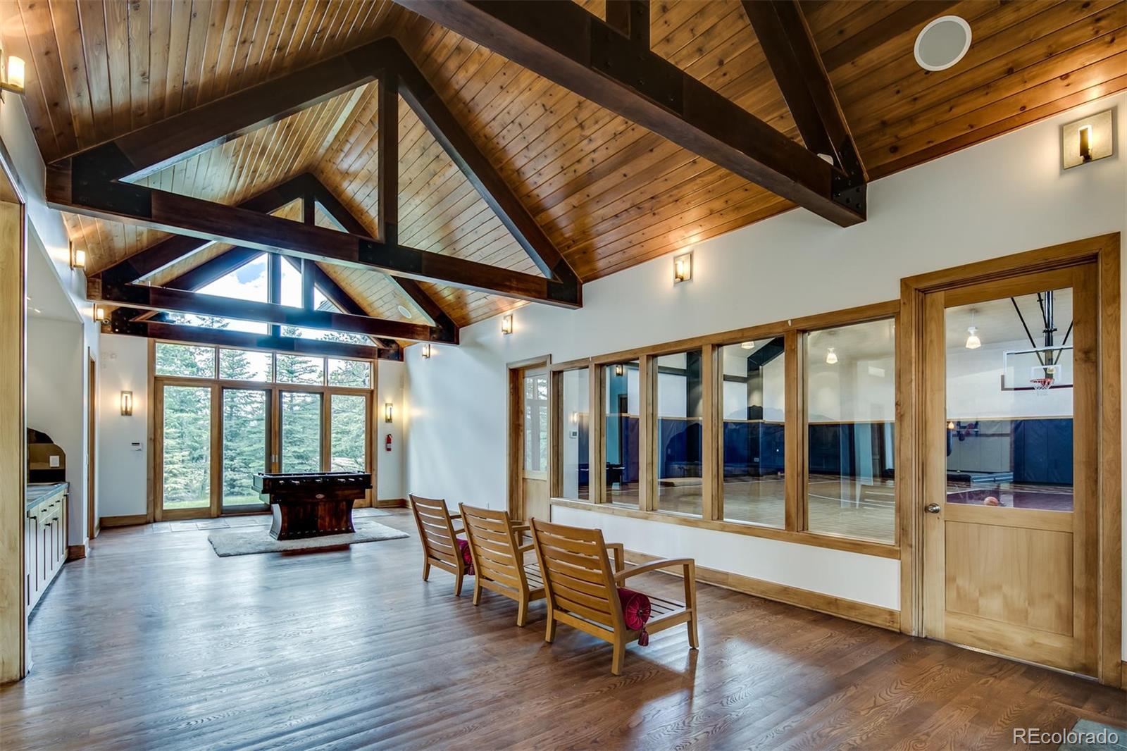 6917 Timbers Drive Evergreen, CO 80439 - Photo 31 of 39 a view of an entryway with hardwood