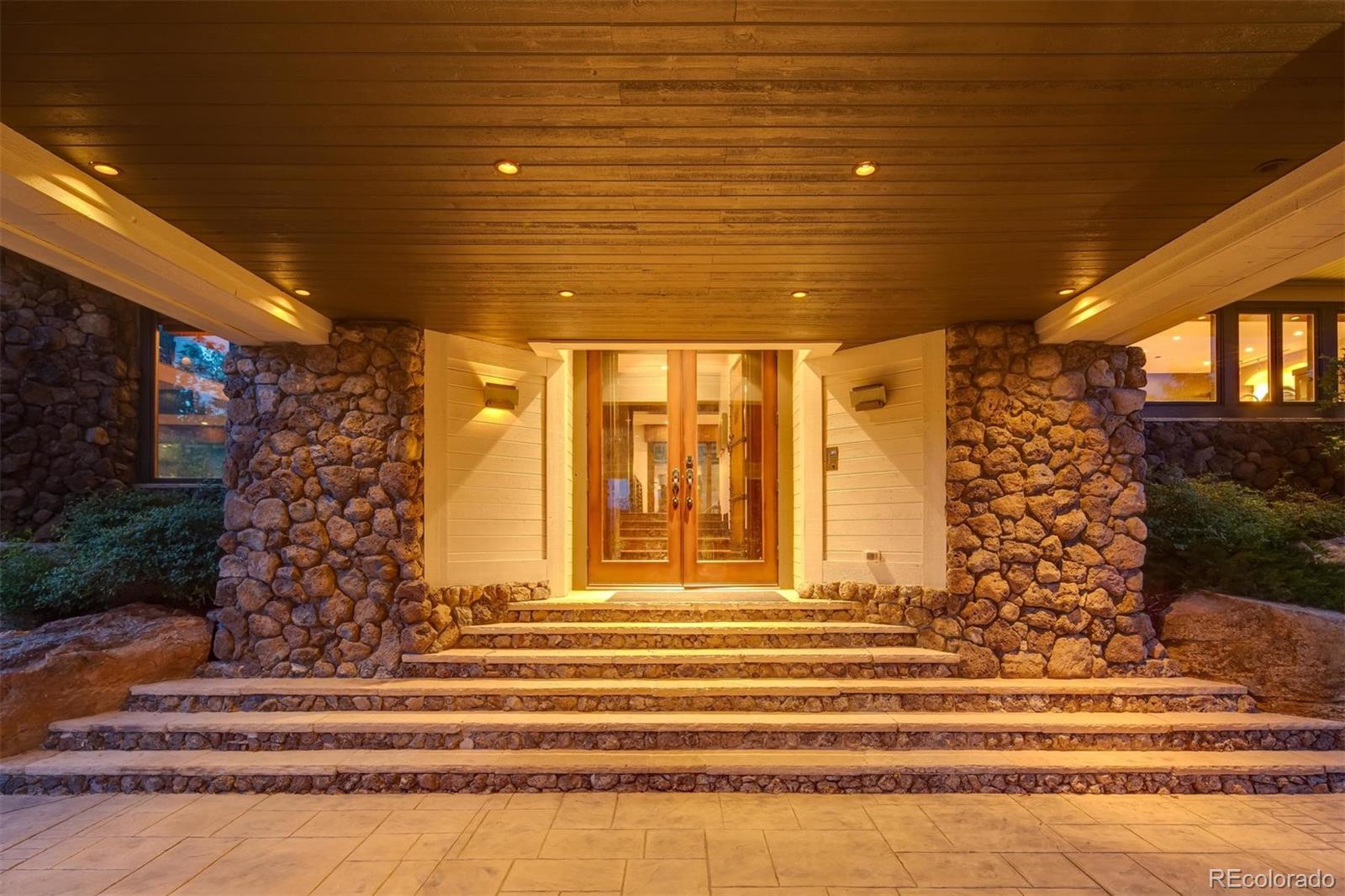6917 Timbers Drive Evergreen, CO 80439 - Photo 4 of 39 a view of a entryway door of the house