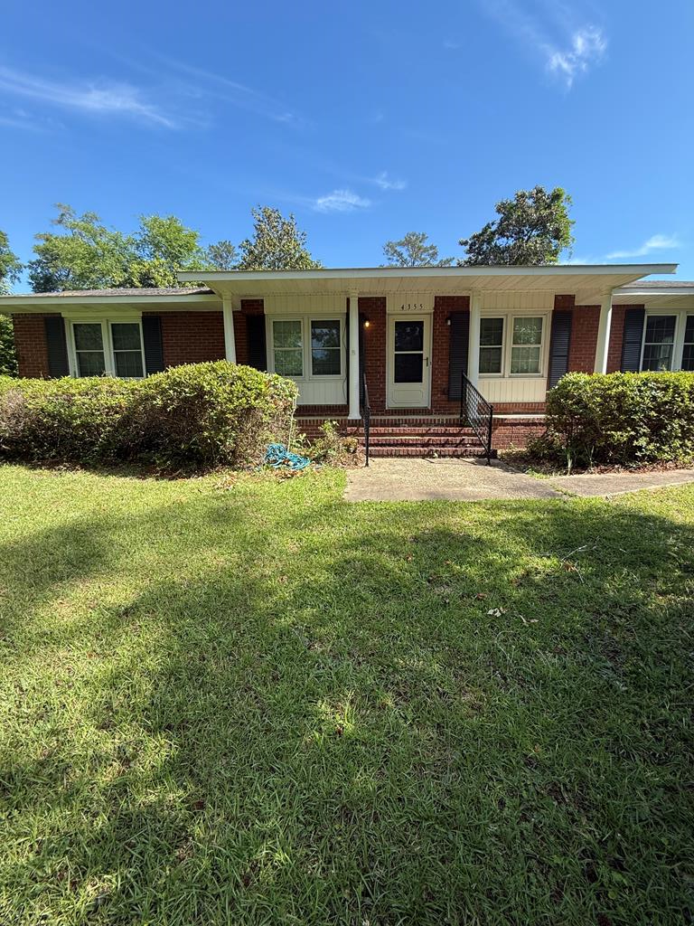4355 Byron Street Columbus, GA 31907 - Photo 1 of 20 a front view of a house with a yard and porch