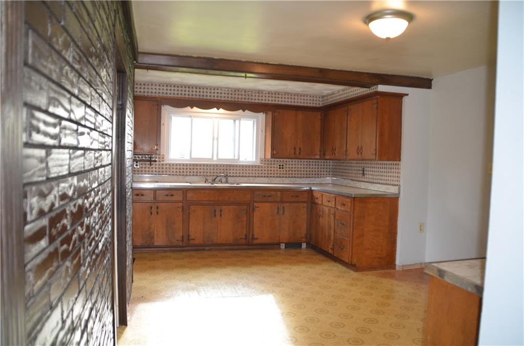 626 Patterson Road Apollo, PA 15613 - Photo 13 of 25 a view of a kitchen with a sink and dishwasher with wooden floor