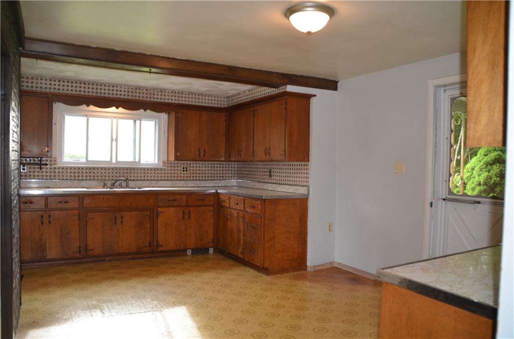 626 Patterson Road Apollo, PA 15613 - Photo 14 of 25 a kitchen with granite countertop white cabinets and white appliances