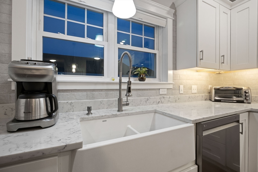 23 Starboard Drive, Unit 50 Wareham, MA 02532 - Photo 14 of 42 a kitchen with a sink and a stove top oven