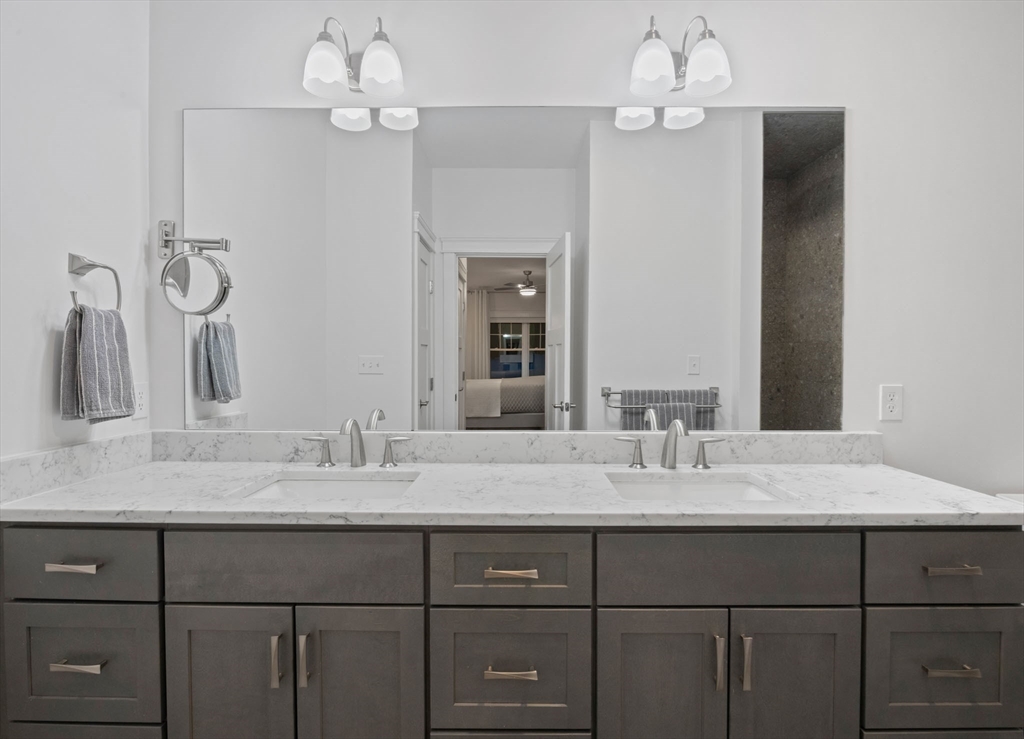 23 Starboard Drive, Unit 50 Wareham, MA 02532 - Photo 24 of 42 a bathroom with a sink vanity and a mirror