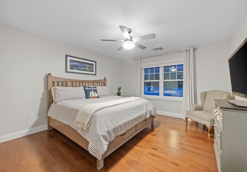 23 Starboard Drive, Unit 50 Wareham, MA 02532 - Photo 30 of 42 a bedroom with a bed and a flat screen tv