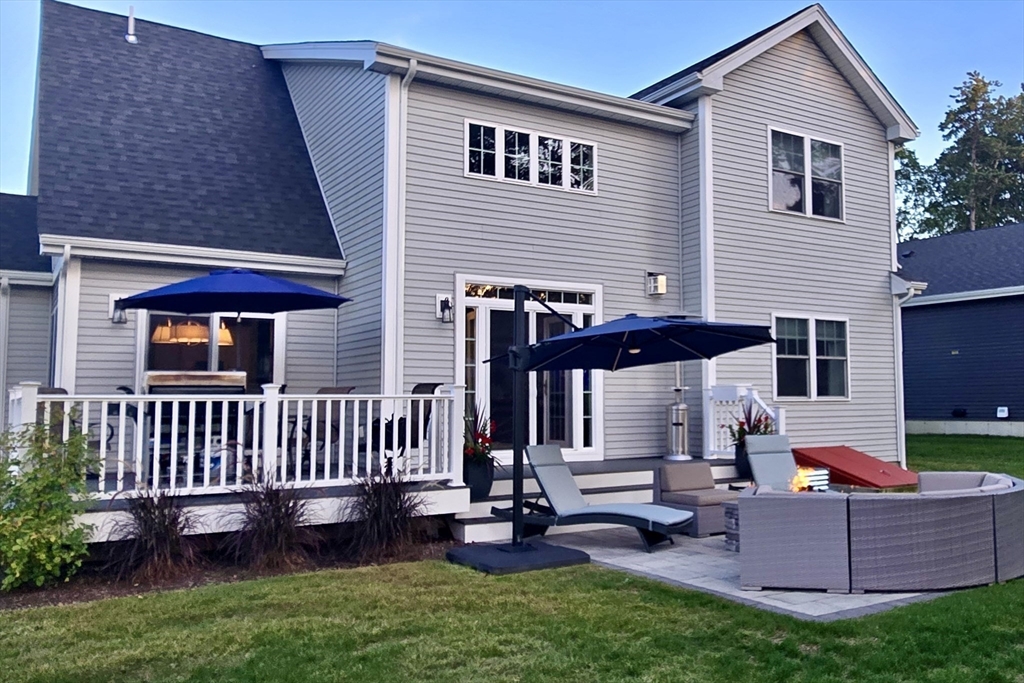 23 Starboard Drive, Unit 50 Wareham, MA 02532 - Photo 36 of 42 a view of a house with backyard and sitting area