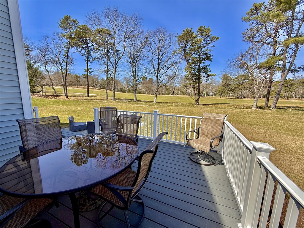 23 Starboard Drive, Unit 50 Wareham, MA 02532 - Photo 38 of 42 a view of a lake with couches table and chairs