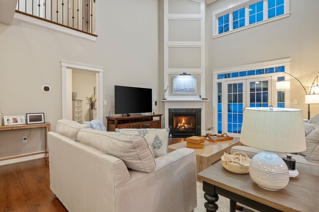 23 Starboard Drive, Unit 50 Wareham, MA 02532 - Photo 4 of 42 a living room with furniture a fireplace and a flat screen tv