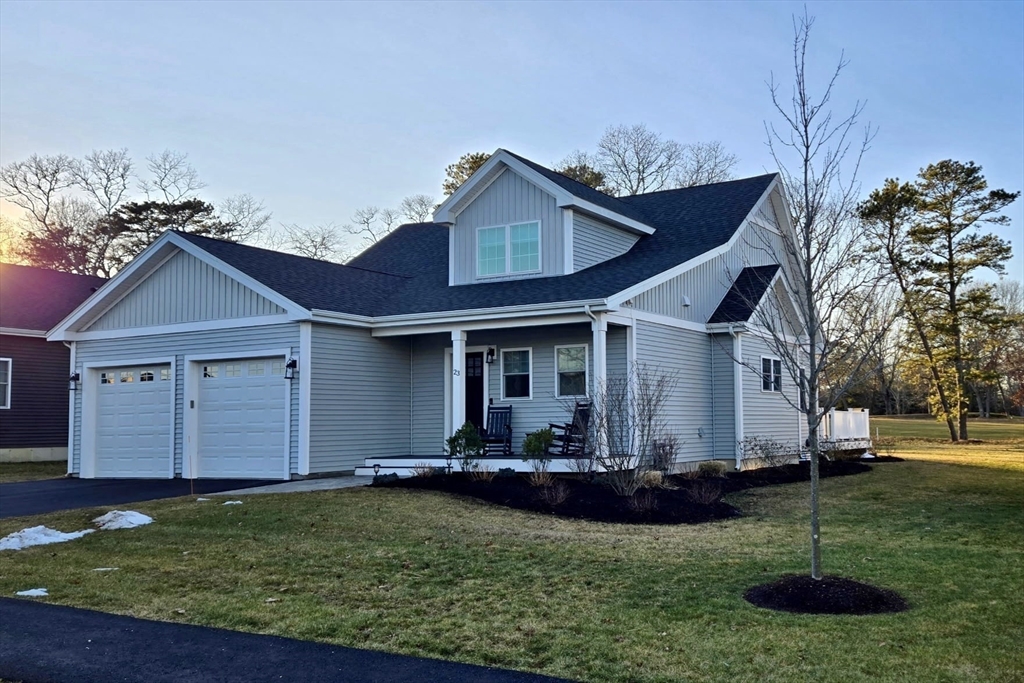 23 Starboard Drive, Unit 50 Wareham, MA 02532 - Photo 5 of 42 a front view of a house with a yard
