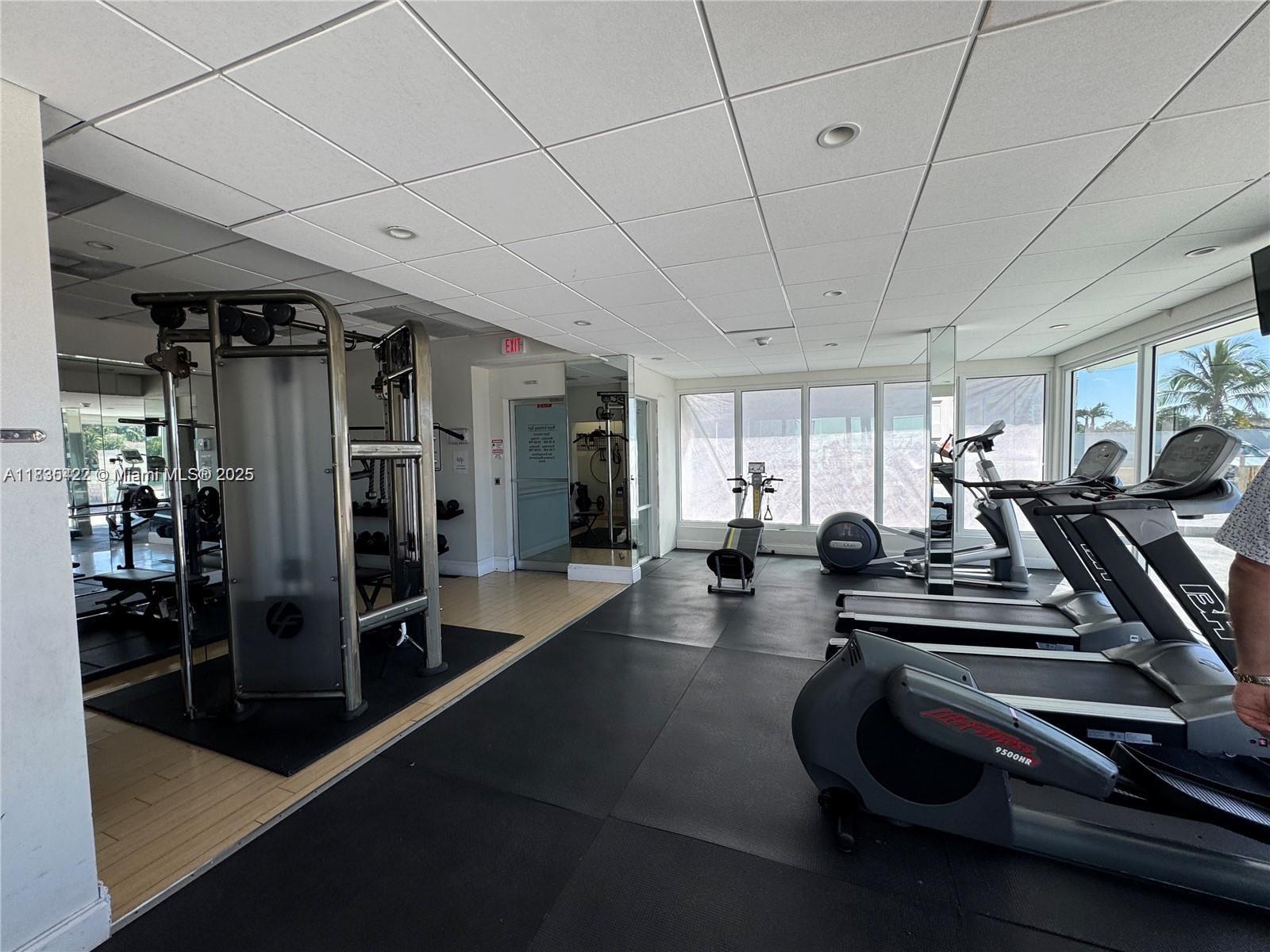 5750 Collins Avenue, Unit 4F Miami Beach, FL 33140 - Photo 12 of 46 a view of a room with gym equipment