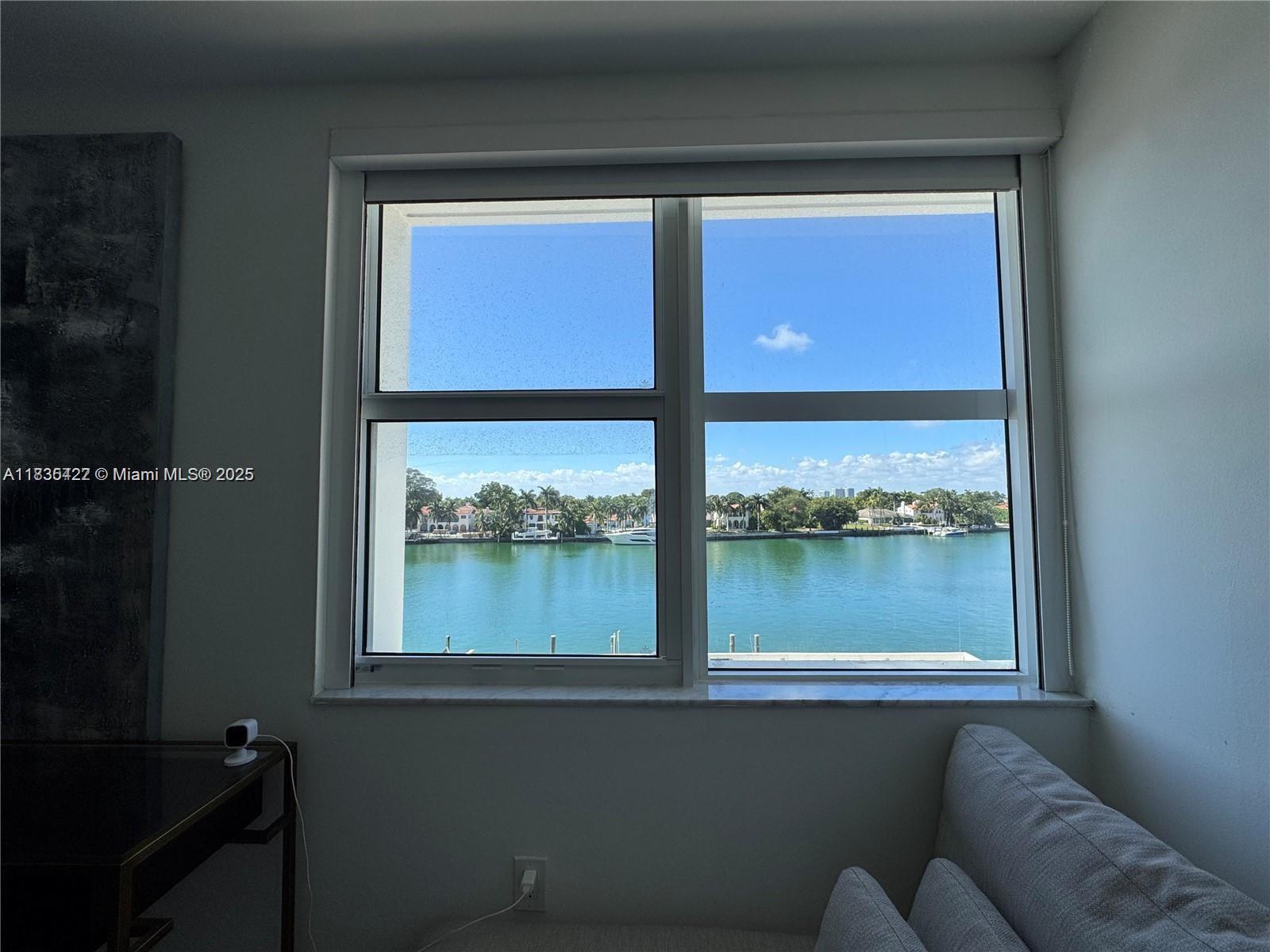 5750 Collins Avenue, Unit 4F Miami Beach, FL 33140 - Photo 24 of 46 a view of a window in a living room