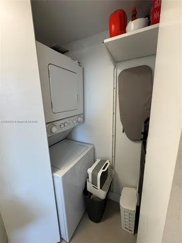 a bathroom with a toilet and a mirror