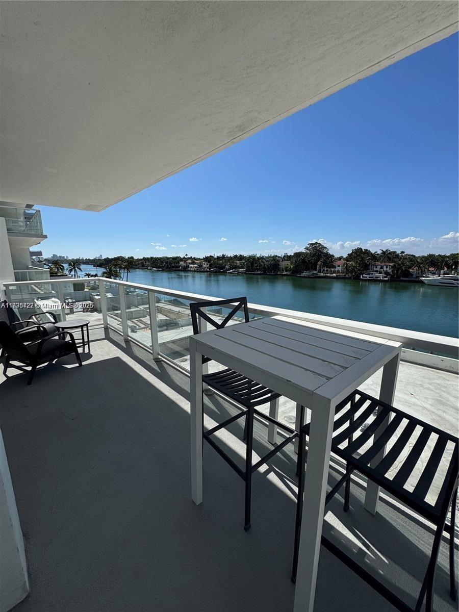 5750 Collins Avenue, Unit 4F Miami Beach, FL 33140 - Photo 46 of 46 a view of a terrace with outdoor seating