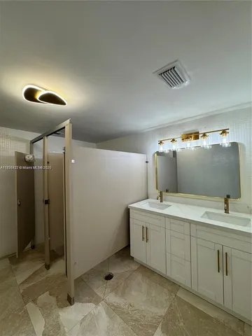 a bathroom with a sink and mirror