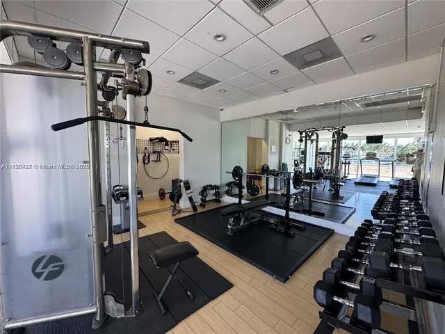 a living room with lots of furniture and white walls