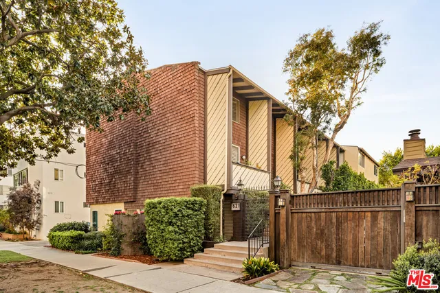 a view of a house with a tree