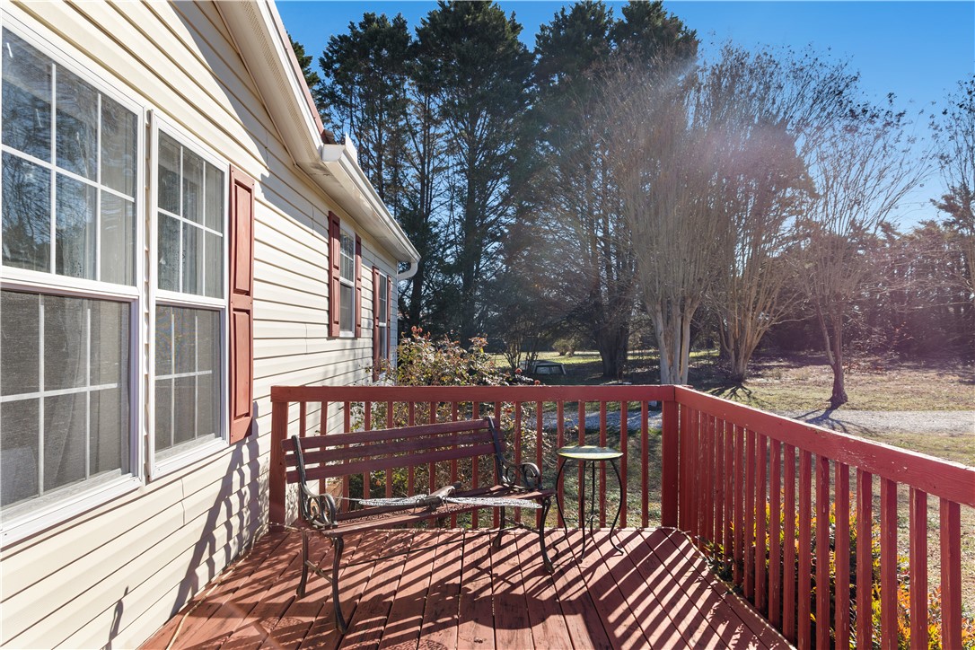811 Pine Grove Road Seneca, SC 29678 - Photo 15 of 20 This inviting outdoor space features a wooden deck, perfect for peaceful relaxation amidst nature.
