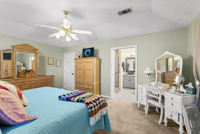 a bathroom with a tub a sink and mirror
