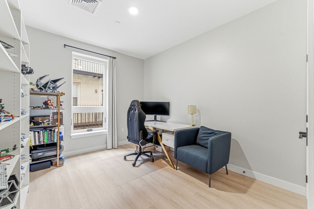 157 Chestnut Street, Unit 203 Chelsea, MA 02150 - Photo 18 of 31 a view of a livingroom with workspace and a window