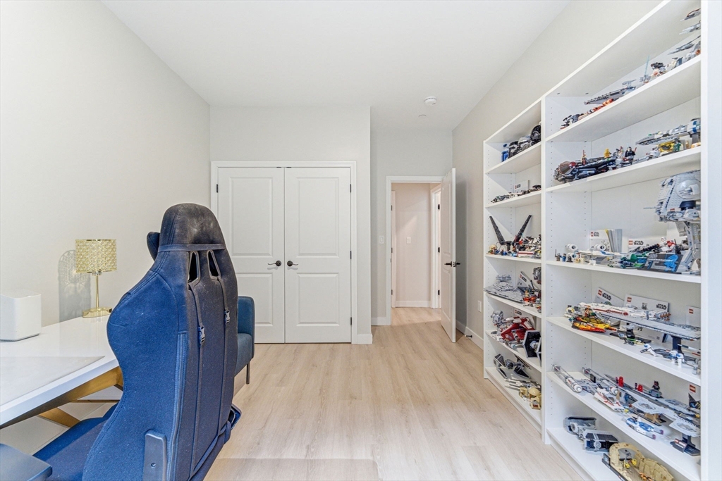 157 Chestnut Street, Unit 203 Chelsea, MA 02150 - Photo 19 of 31 a view of a bedroom with baby toys