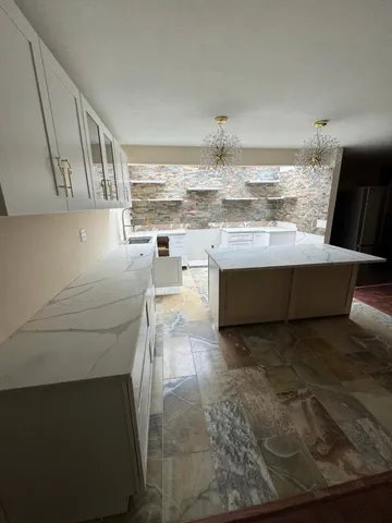 a view of kitchen and wooden floor