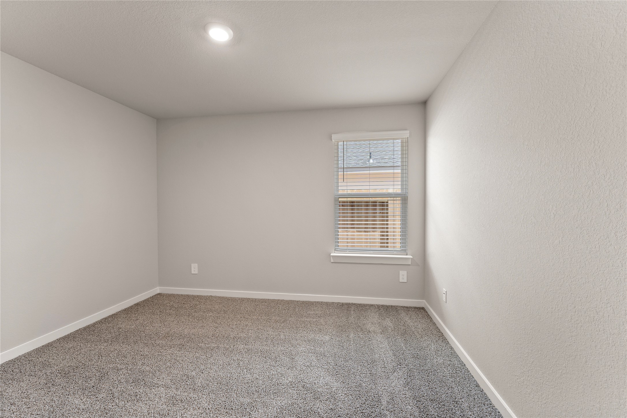 12722 Basinghall Lane Houston, TX 77047 - Photo 18 of 22 an empty room with a window