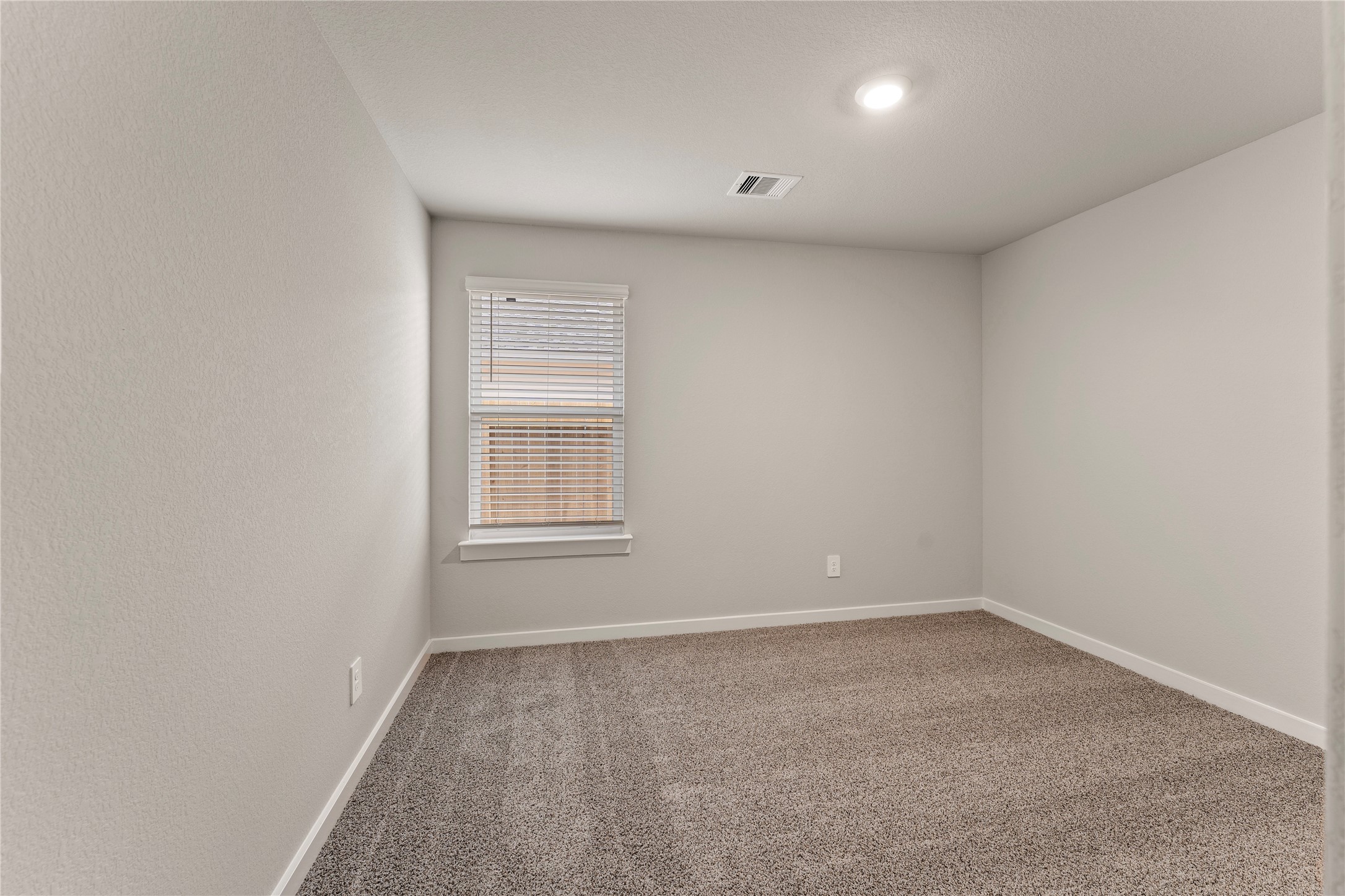 12722 Basinghall Lane Houston, TX 77047 - Photo 19 of 22 an empty room with a window