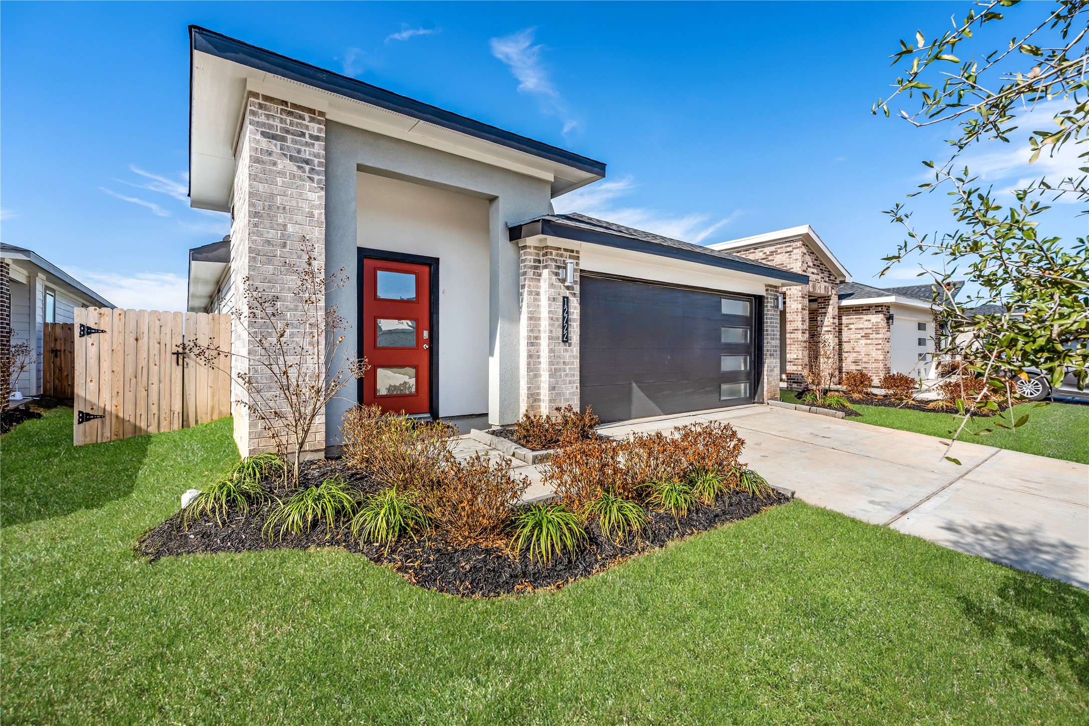 12722 Basinghall Lane Houston, TX 77047 - Photo 22 of 22 a front view of a house with a yard
