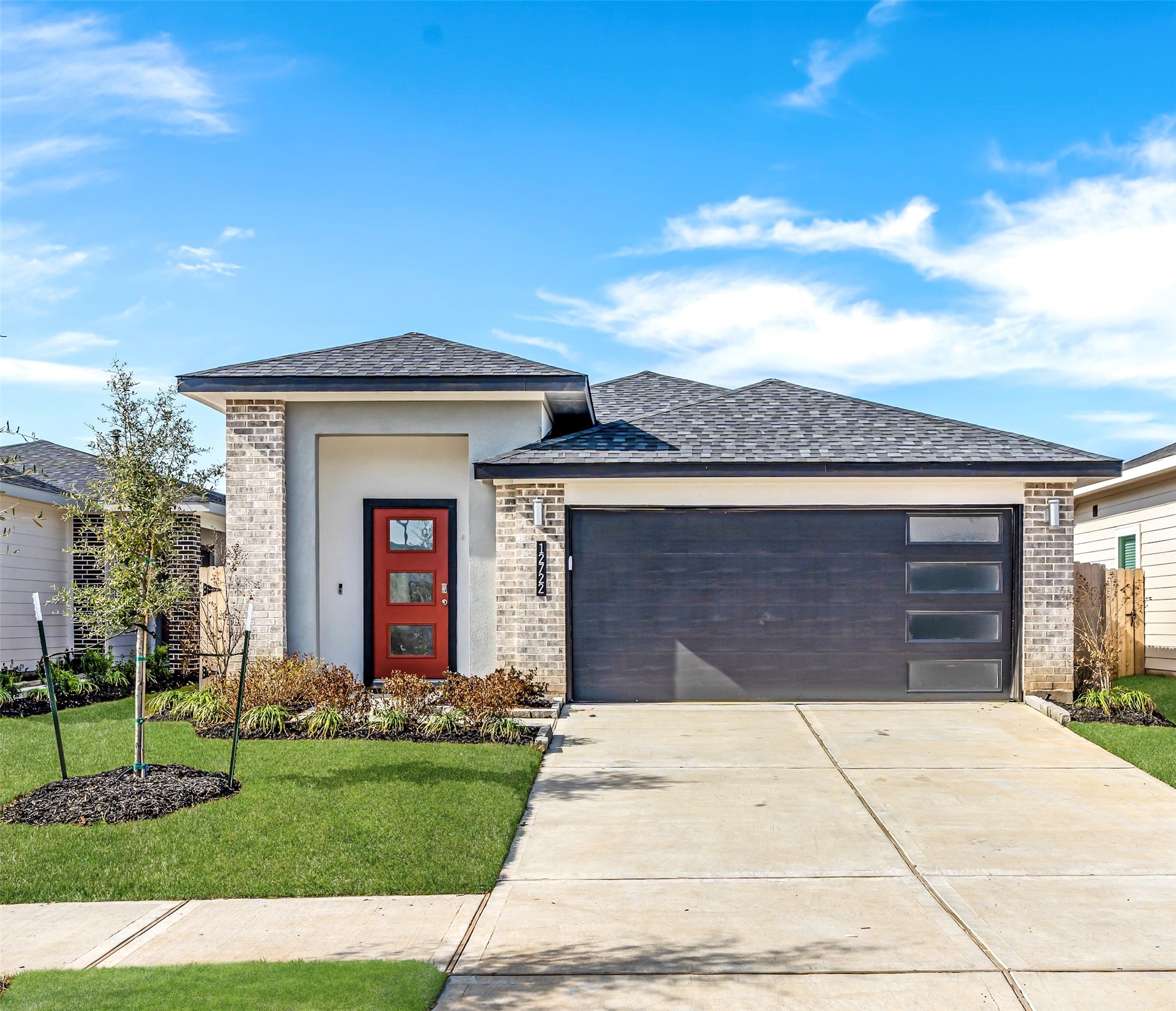 12722 Basinghall Lane Houston, TX 77047 - Photo 3 of 22 a front view of a house with a yard