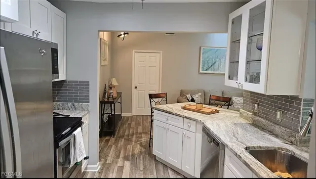 a kitchen with a sink stove and refrigerator
