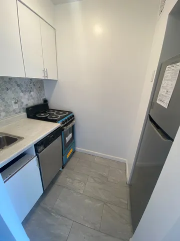 a kitchen with a stove and a sink