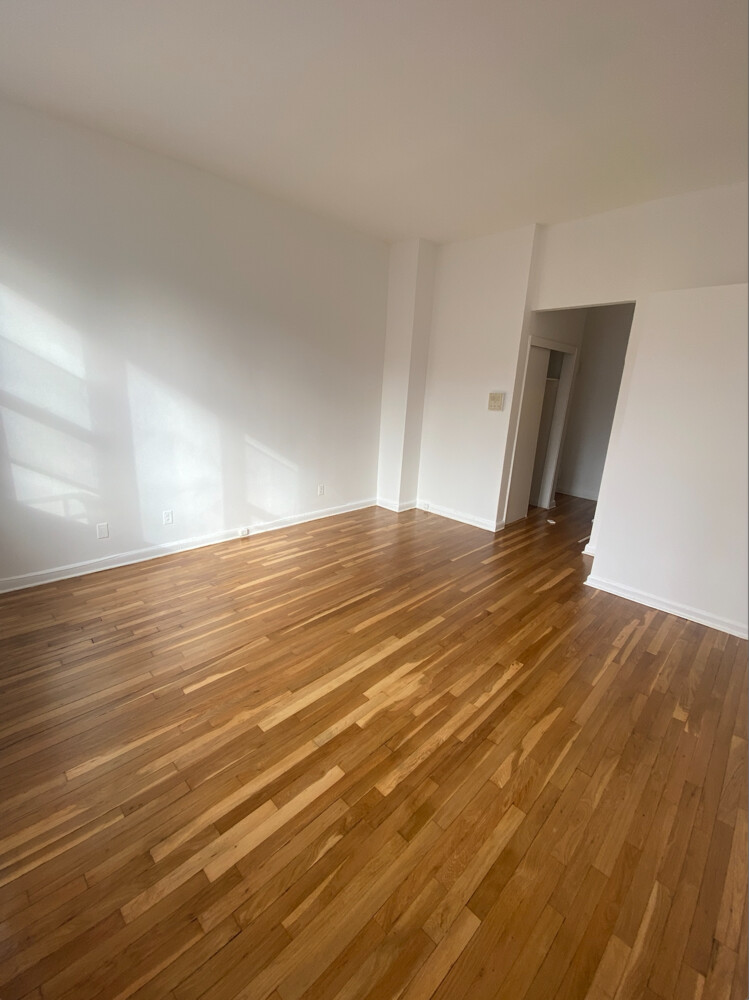 515 East 82nd Street, Unit 5A Manhattan, NY 10028 - Photo 4 of 5 a view of empty room with wooden floor