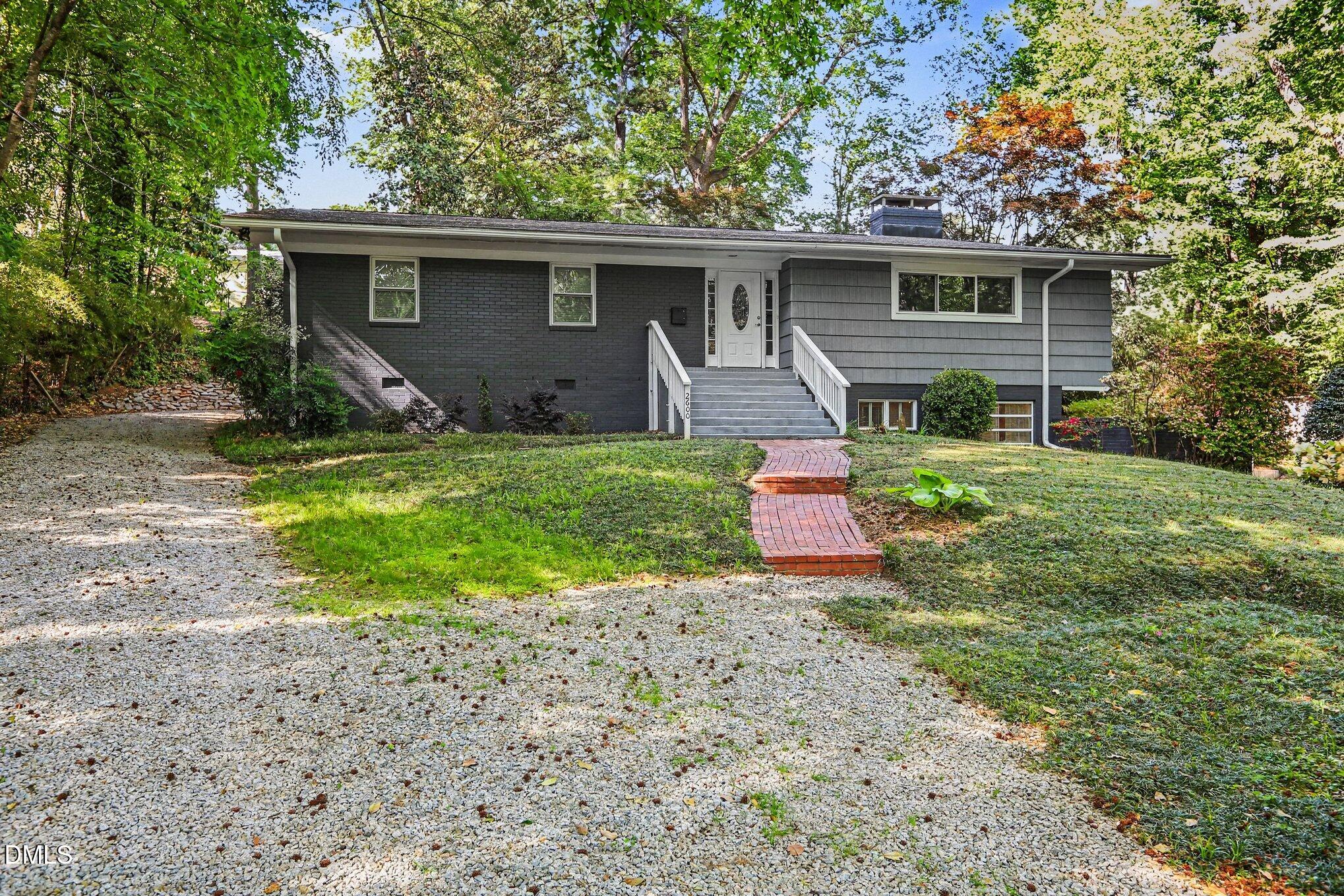 2600 Wade Avenue Raleigh, NC 27607 - Photo 2 of 31 a front view of house with yard and green space