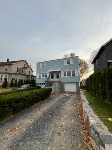 a view of a house with a back yard