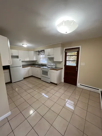 a kitchen with stainless steel appliances granite countertop a sink and cabinets