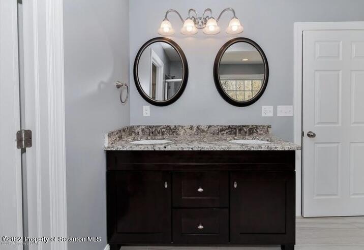 129 Wellington Road Shavertown, PA 18708 - Photo 11 of 16 a bathroom with a sink and a mirror