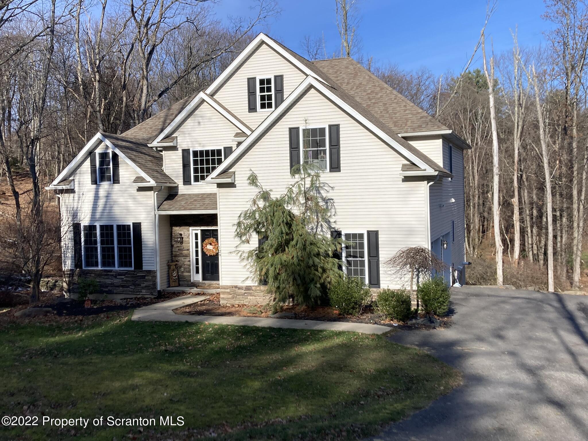 129 Wellington Road Shavertown, PA 18708 - Photo 2 of 16 a front view of a house with a yard