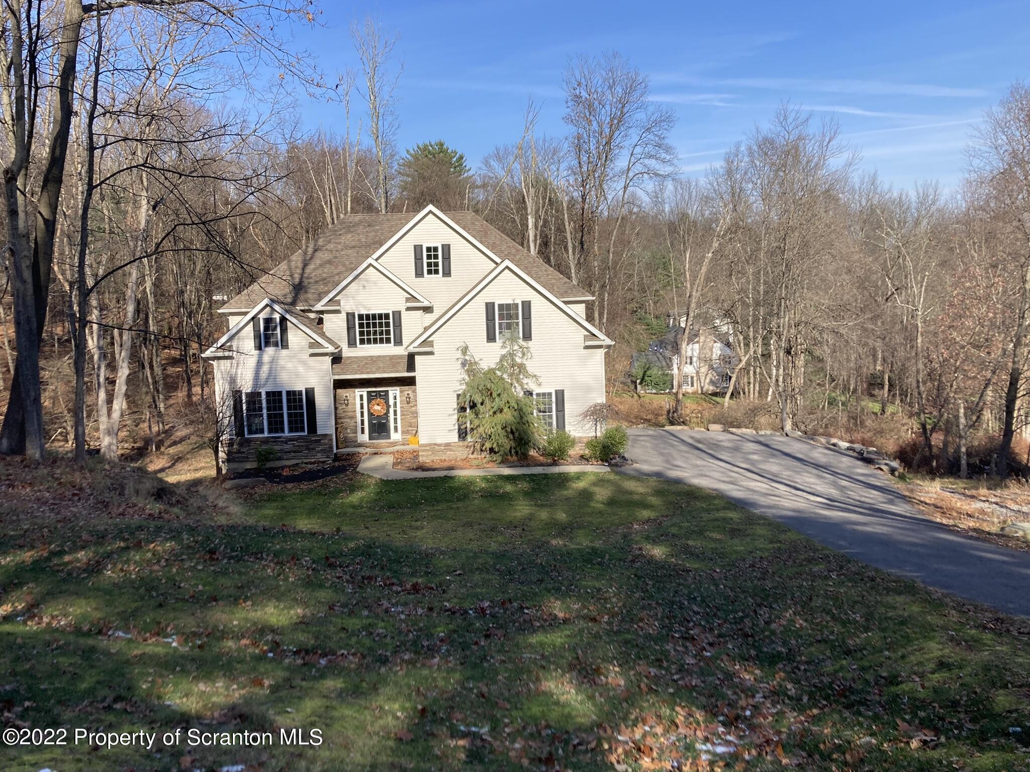 129 Wellington Road Shavertown, PA 18708 - Photo 3 of 16 a view of a back yard of the house