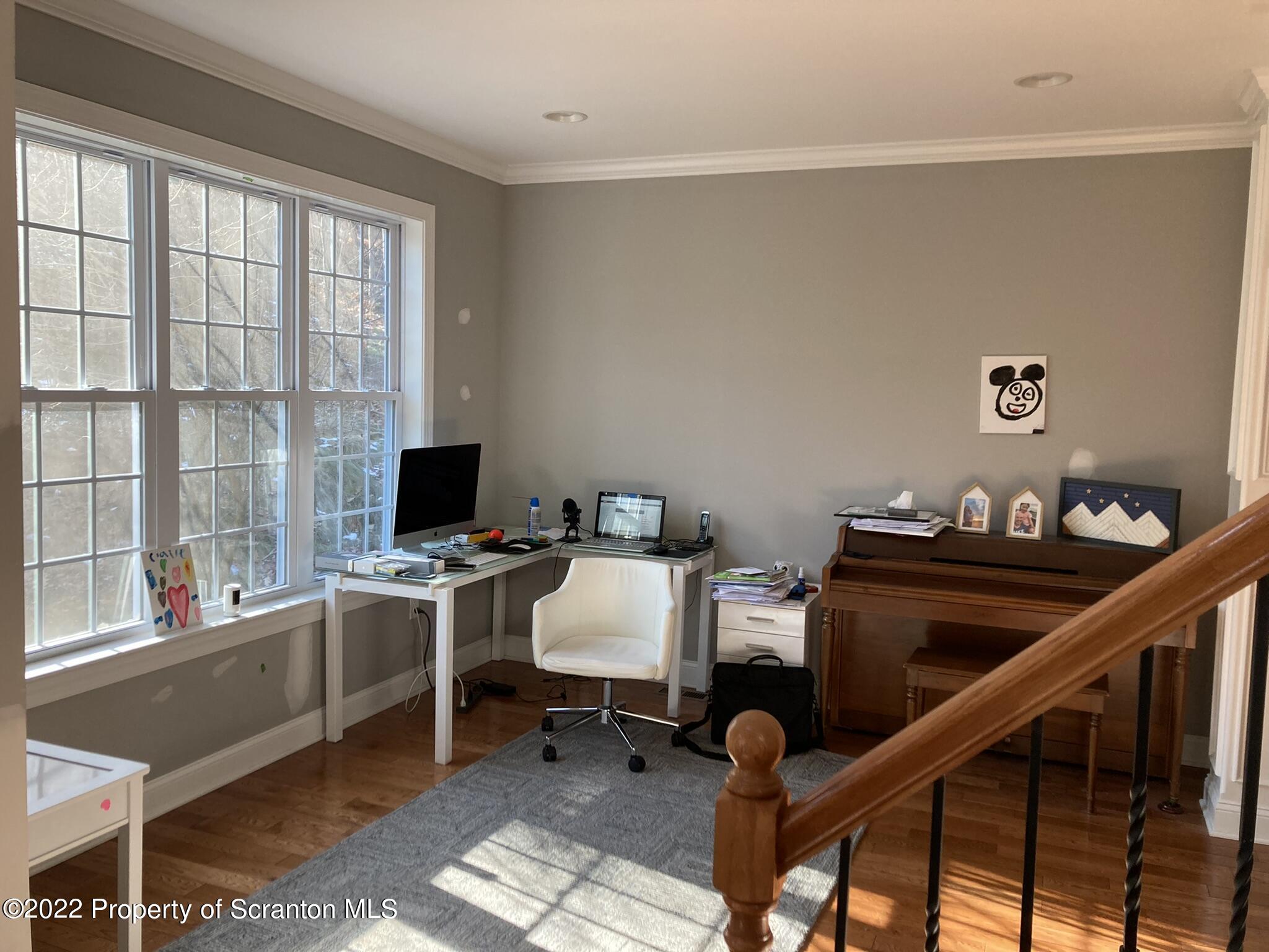 129 Wellington Road Shavertown, PA 18708 - Photo 8 of 16 a view of a workspace with furniture and a window