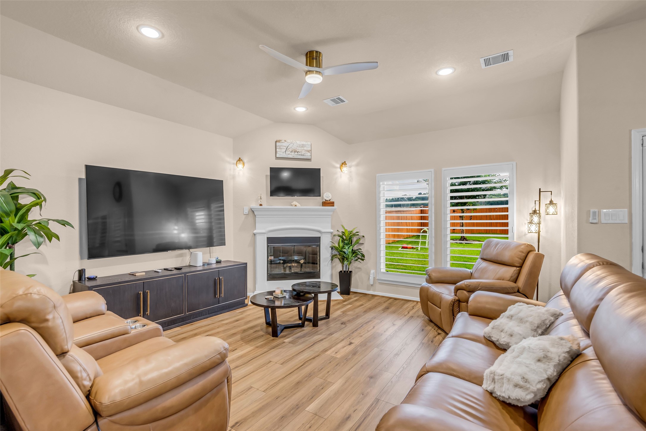 22907 Banff Brook Way Tomball, TX 77375 - Photo 3 of 26 The living room featuring a gas-log fireplace that adds warmth and a cozy focal point to the space.