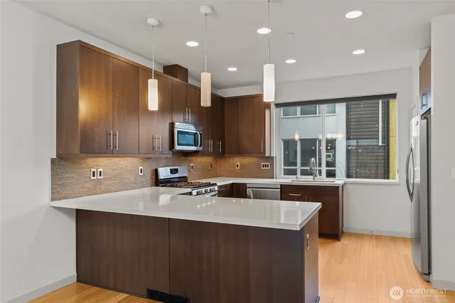 a kitchen with a sink cabinets and window