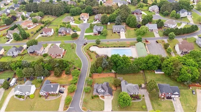 an aerial view of residential house with outdoor space and lake view