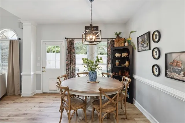 a dining room with furniture and window