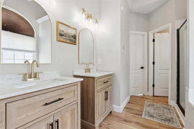 a spacious bathroom with a double vanity sink mirror and