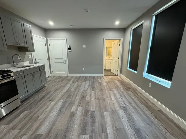 a view of a kitchen with wooden floor