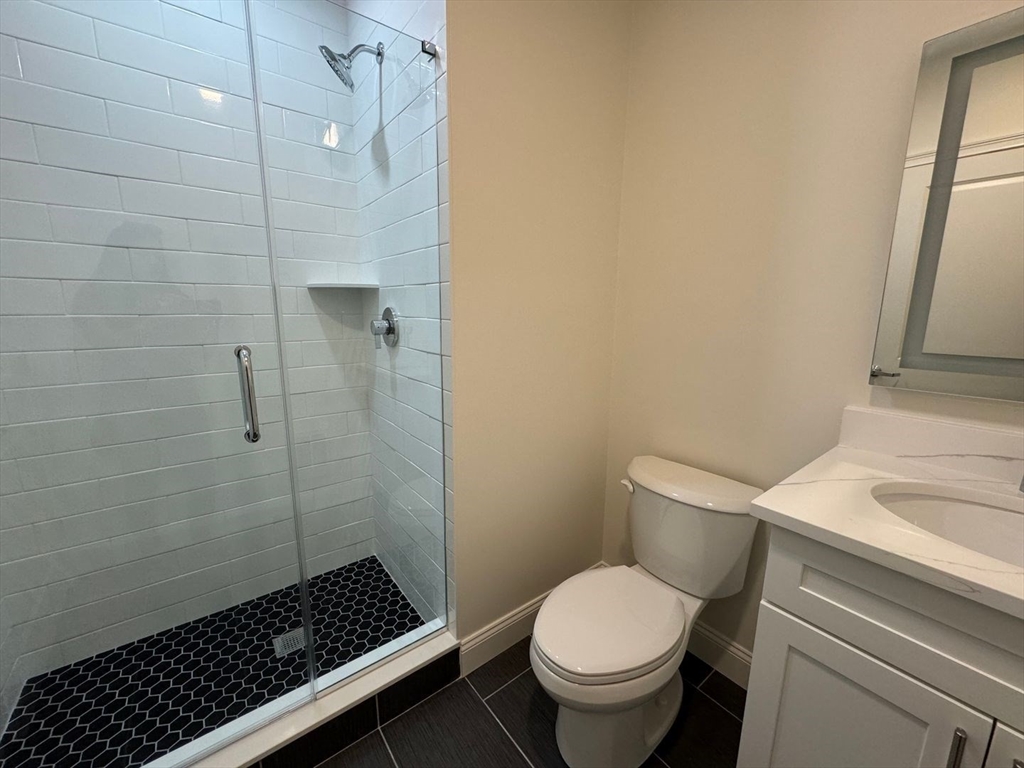 55 Walnut Avenue, Unit 103 Revere, MA 02151 - Photo 7 of 7 a bathroom with a toilet and a shower