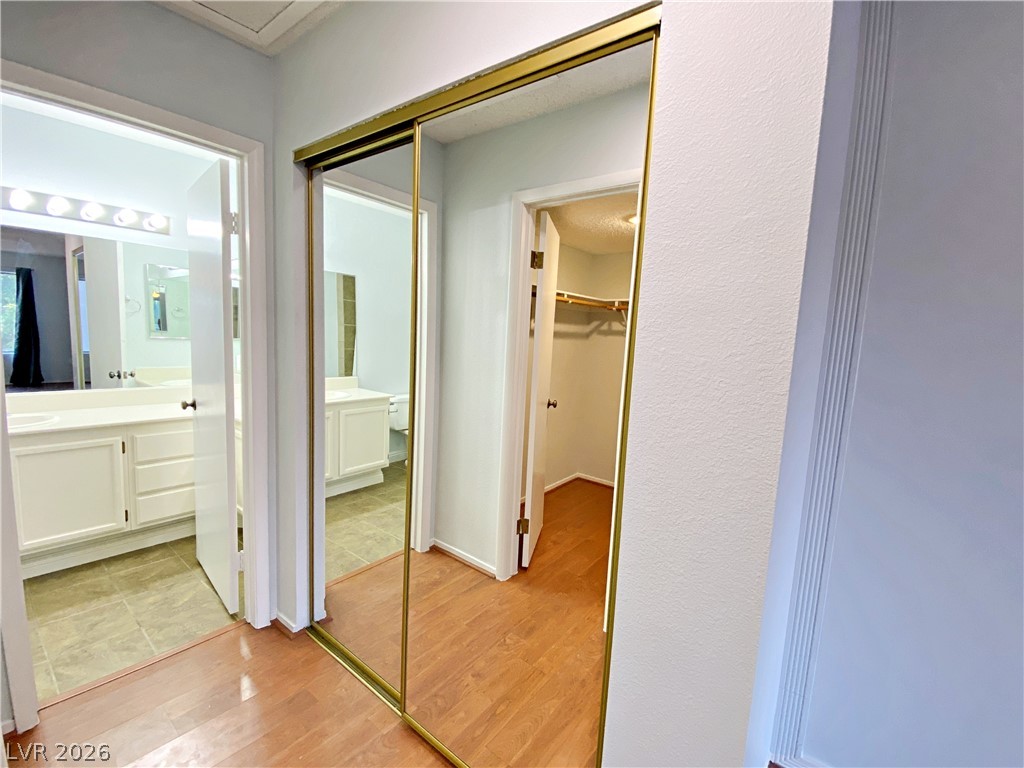 1575 West Warm Springs Road, Unit 1024 Henderson, NV 89014 - Photo 18 of 25 Well-lit interior space features gleaming hardwood flooring and ample storage.