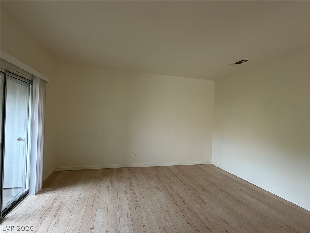 5525 West Flamingo Road, Unit 2016 Las Vegas, NV 89103 - Photo 12 of 20 Unfurnished bedroom with light wood finished floors and baseboards