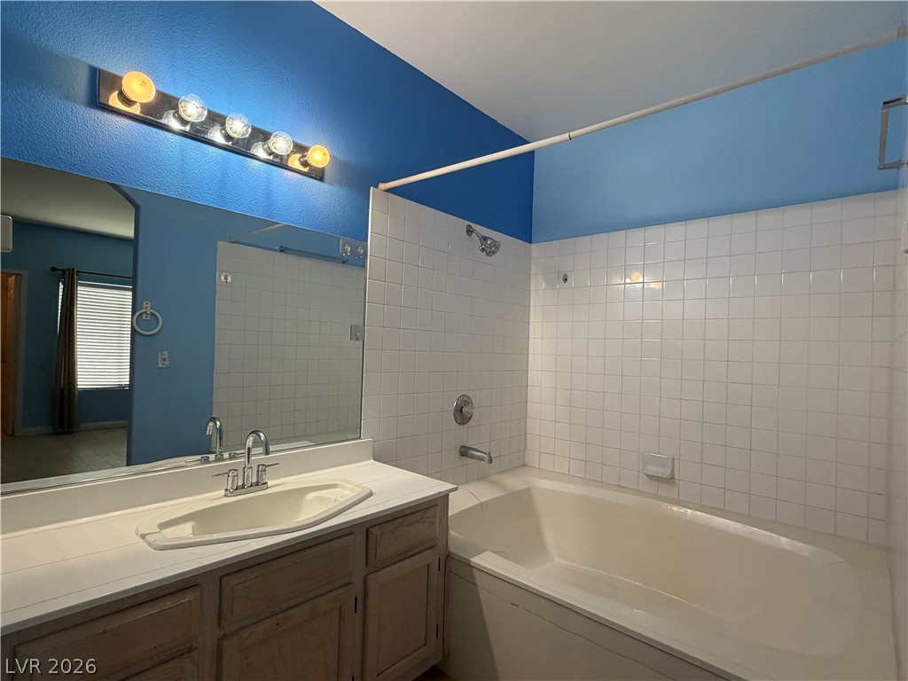 5525 West Flamingo Road, Unit 2016 Las Vegas, NV 89103 - Photo 16 of 20 Bathroom featuring vanity and shower combination