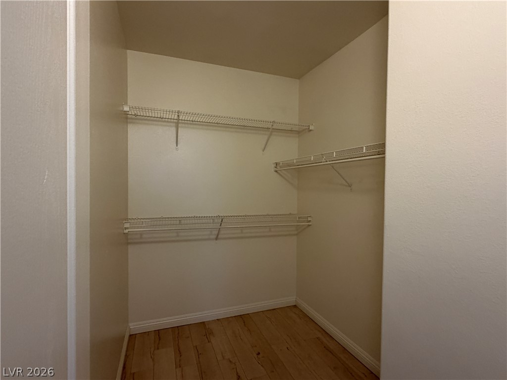 5525 West Flamingo Road, Unit 2016 Las Vegas, NV 89103 - Photo 18 of 20 Walk in closet featuring light wood-type flooring